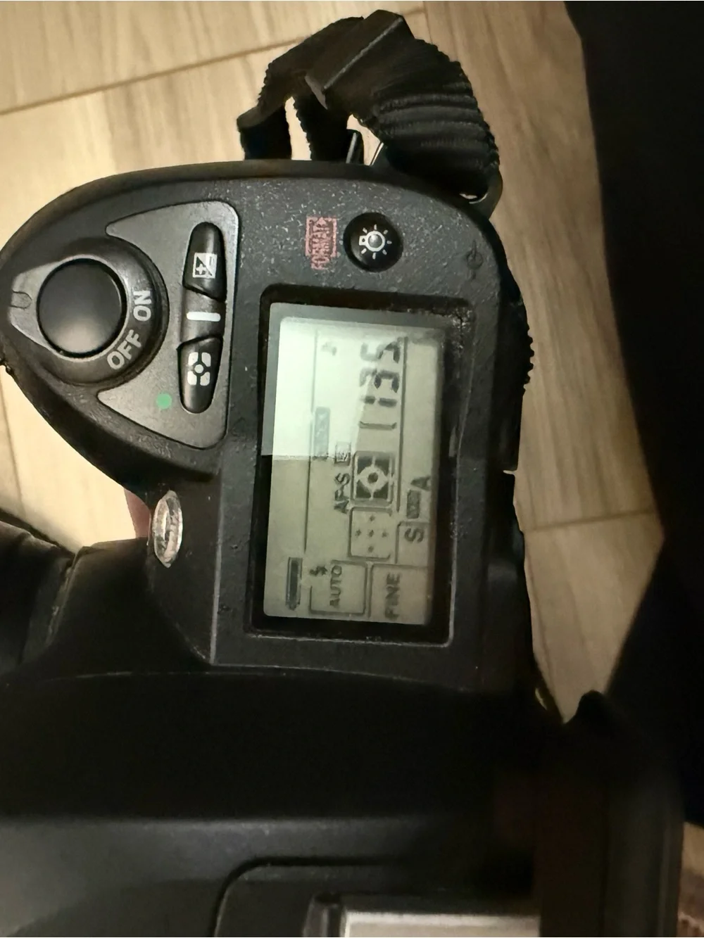 Nikon DSLR Camera in Black with Attached Lens